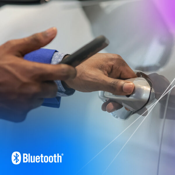 A close up on the hands of a person in a blue shirt opening a car door using Bluetooth Channel Sounding enabled digital key.